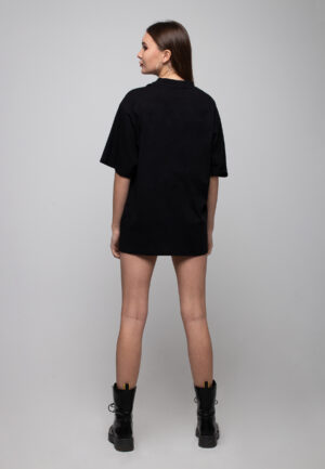 Back view of a black oversized cotton t-shirt with a white woman silhouette print